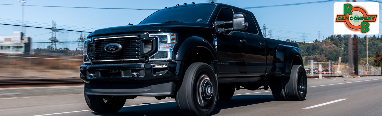 Heavy-duty dual rear wheel pickup truck towing a large trailer near Fort Wayne, Indiana.
