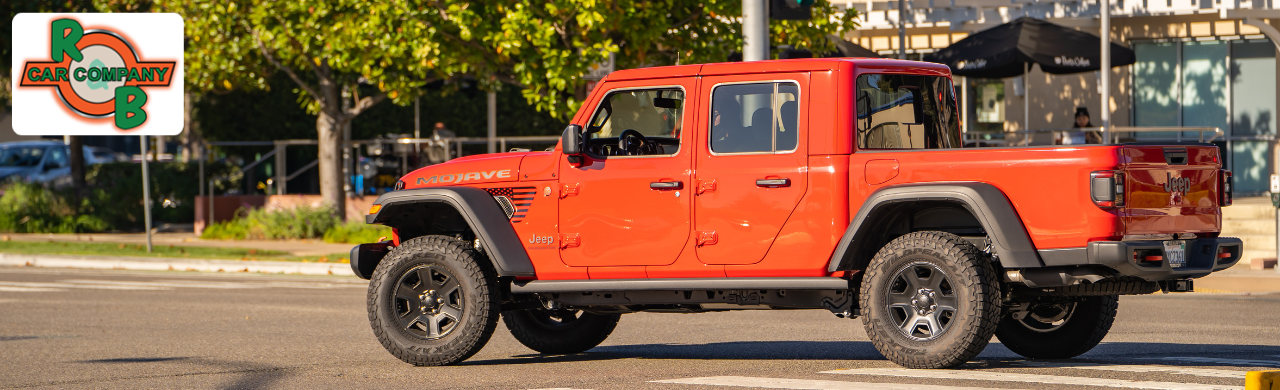Jeep Gladiator parked on an off-road trail near Warsaw, Indiana, showcasing open-air design and rugged capability