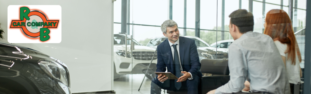 Happy customer exploring certified pre-owned vehicles at a trusted used car dealership near Warsaw.