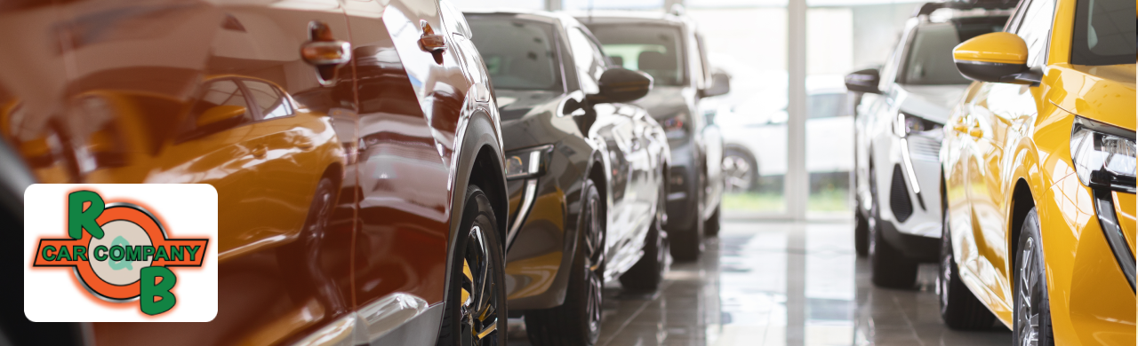  Exterior view of R&B Car Company dealership in Warsaw, IN, showcasing a variety of fuel-efficient cars on the lot.