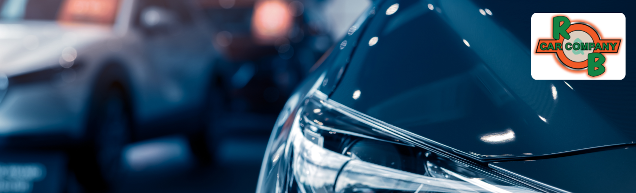 Close-up of a shiny car headlight with a blurred background